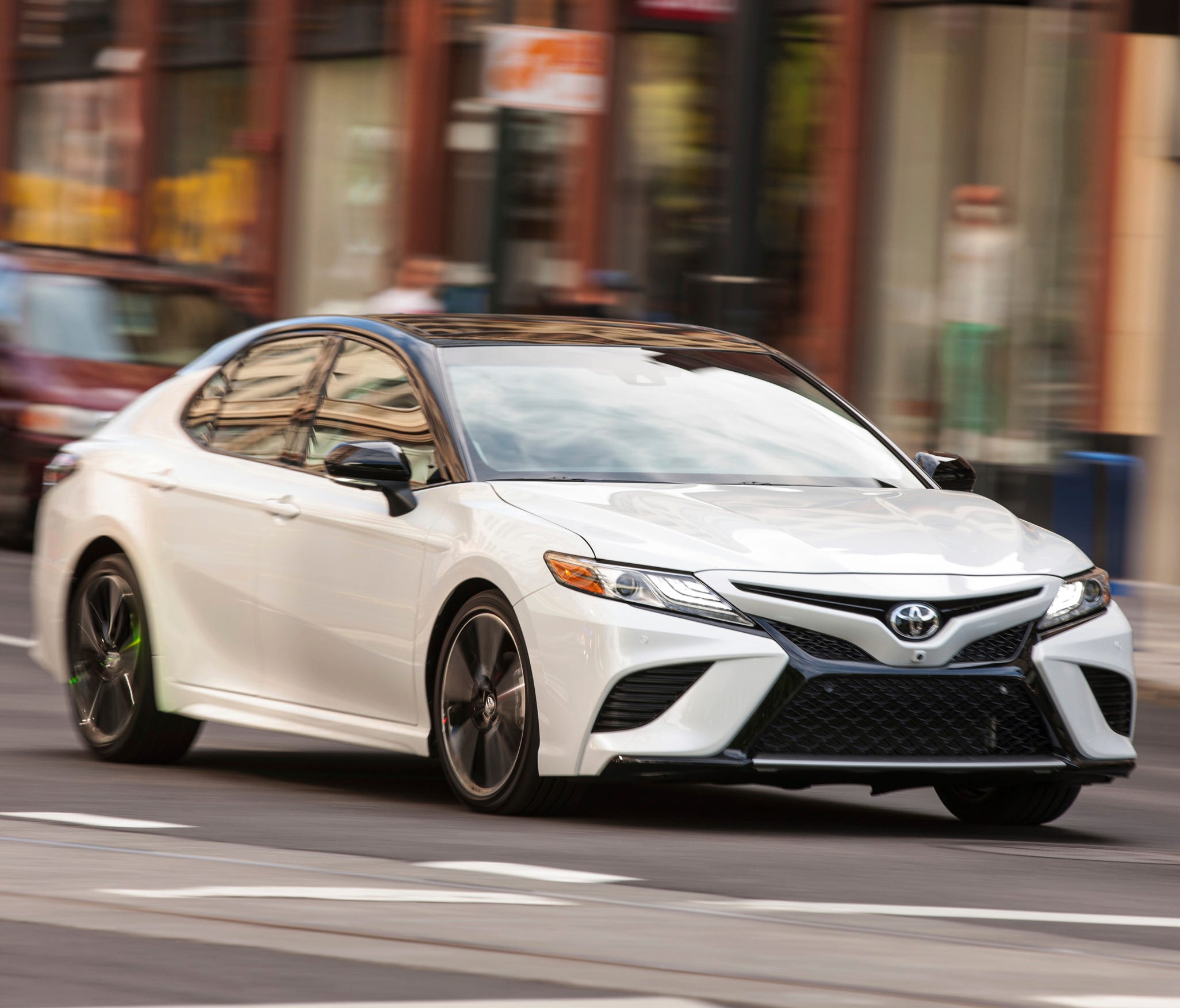 This photo provided by Toyota shows the 2018 Toyota Camry, one of the most popular midsize sedans sold in America. It's been completely redesigned for 2018, with better handling and improved fuel economy without any compromises to usability or utilit