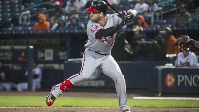 In this photo taken Oct. 1, 2015, Washington Nationals right fielder Bryce Harper (34) bats against the Atlanta Braves during the first inning of a baseball game in Atlanta. Harper is a lot of things, namely the Washington Nationals’ best player and the reigning National League MVP. One thing he’s not is a leader. Harper arrived at Nationals spring training early and quietly took his place in the corner of the clubhouse with Ryan Zimmerman, Jayson Werth and Danny Espinosa. Even after being a unanimous MVP selection, the 23-year-old Harper would rather leave the leadership to those veterans. (AP Photo/John Amis)