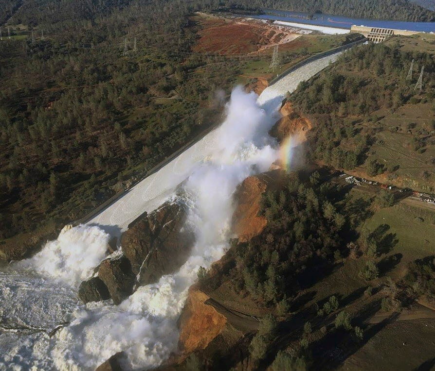 This aerial photo released by the California Department of Water Resources shows the damaged spillway with eroded hillside in Oroville, Calif.