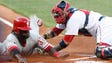 June 12: The Phillies' Odubel Herrera, left, is tagged