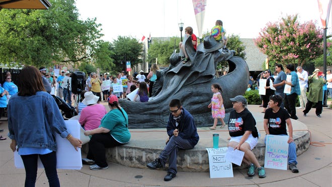 A rally that in part railed against the separation of children from families was centered at the "Childhood's Great Adventure" statue at Everman Park in Abilene on Saturday evening. More than 200 attended the event, main people bringing signs or expressing their opinions on T-shirts.