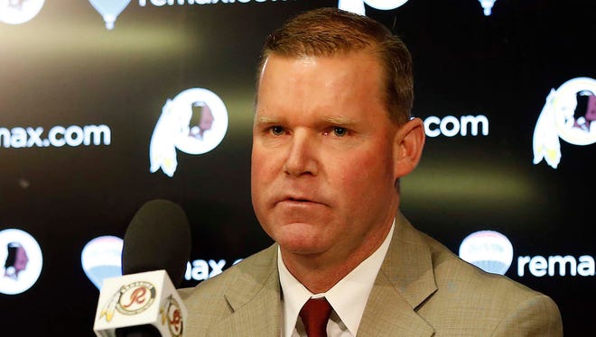 Washington Redskins new general manager Scot McCloughan (right) speaks during his introductory press conference at Redskins Park.