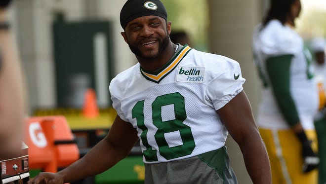 Packers WR Randall Cobb set career bests in catches, yards and TDs in 2014, earning his new contract.