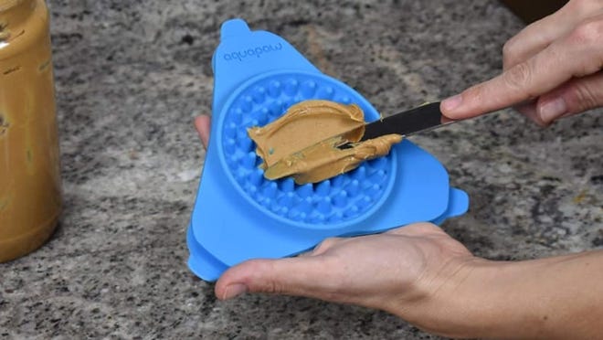 20 Essential Pet Accessories for You : Pet Items for New Dog Owners 24 This silicone mat sticks to the wall of your shower.