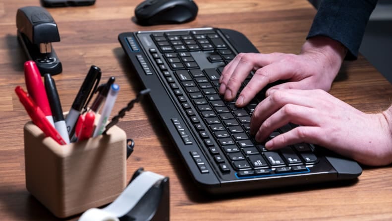 The sticky side of a Post-it note works wonders for grabbing crumbs and grime stuck between the keys on your keyboard.