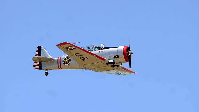 A WWII-era trainer does a fly-by over the crowd during a performance in the Dyess Big Country AirFest on Saturday, May 6, 2017, at the Abilene Regional Airport. 