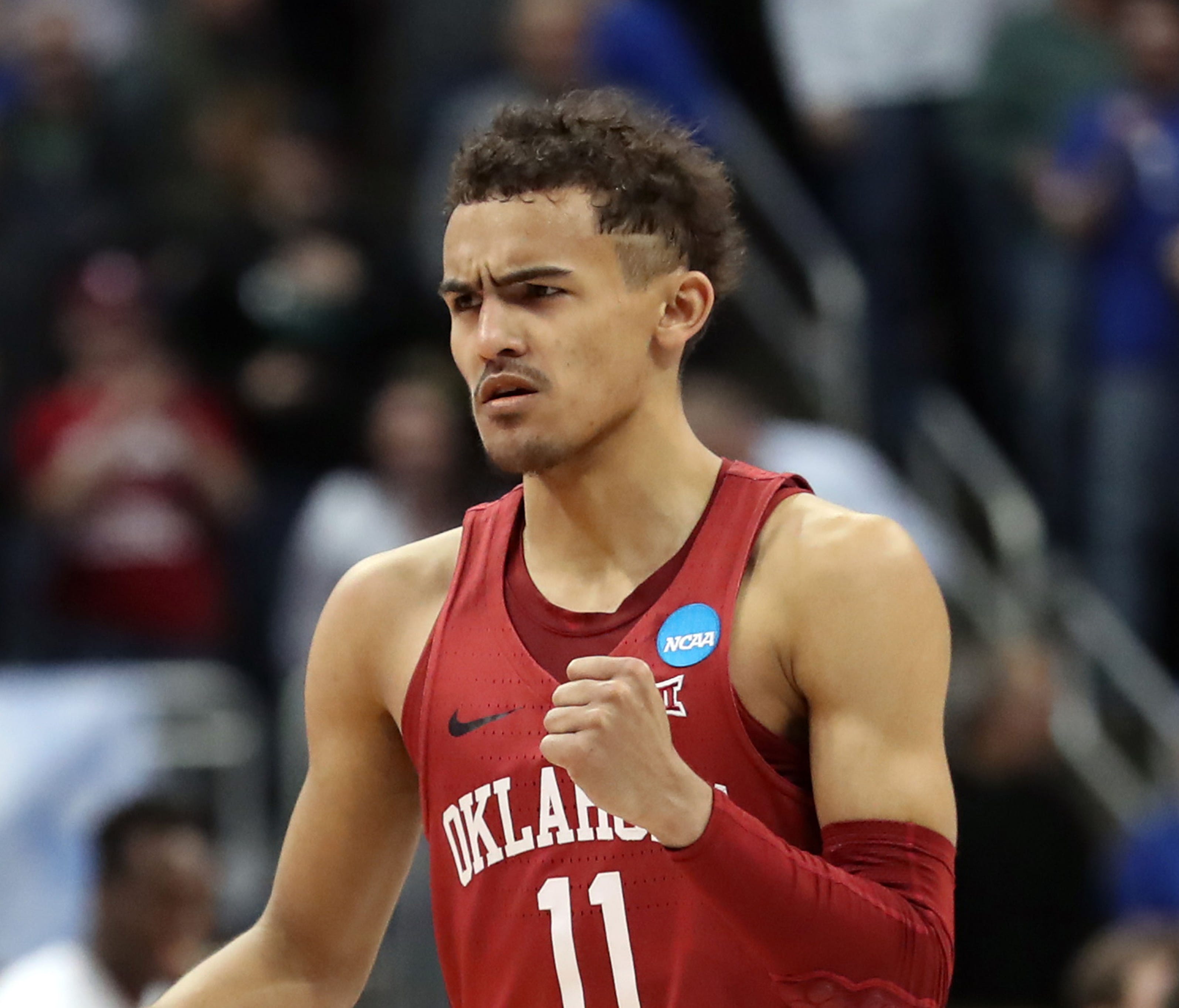 Oklahoma Sooners guard Trae Young (11) reacts after a play against the Rhode Island Rams during the second half in the first round of the 2018 NCAA Tournament at PPG Paints Arena.