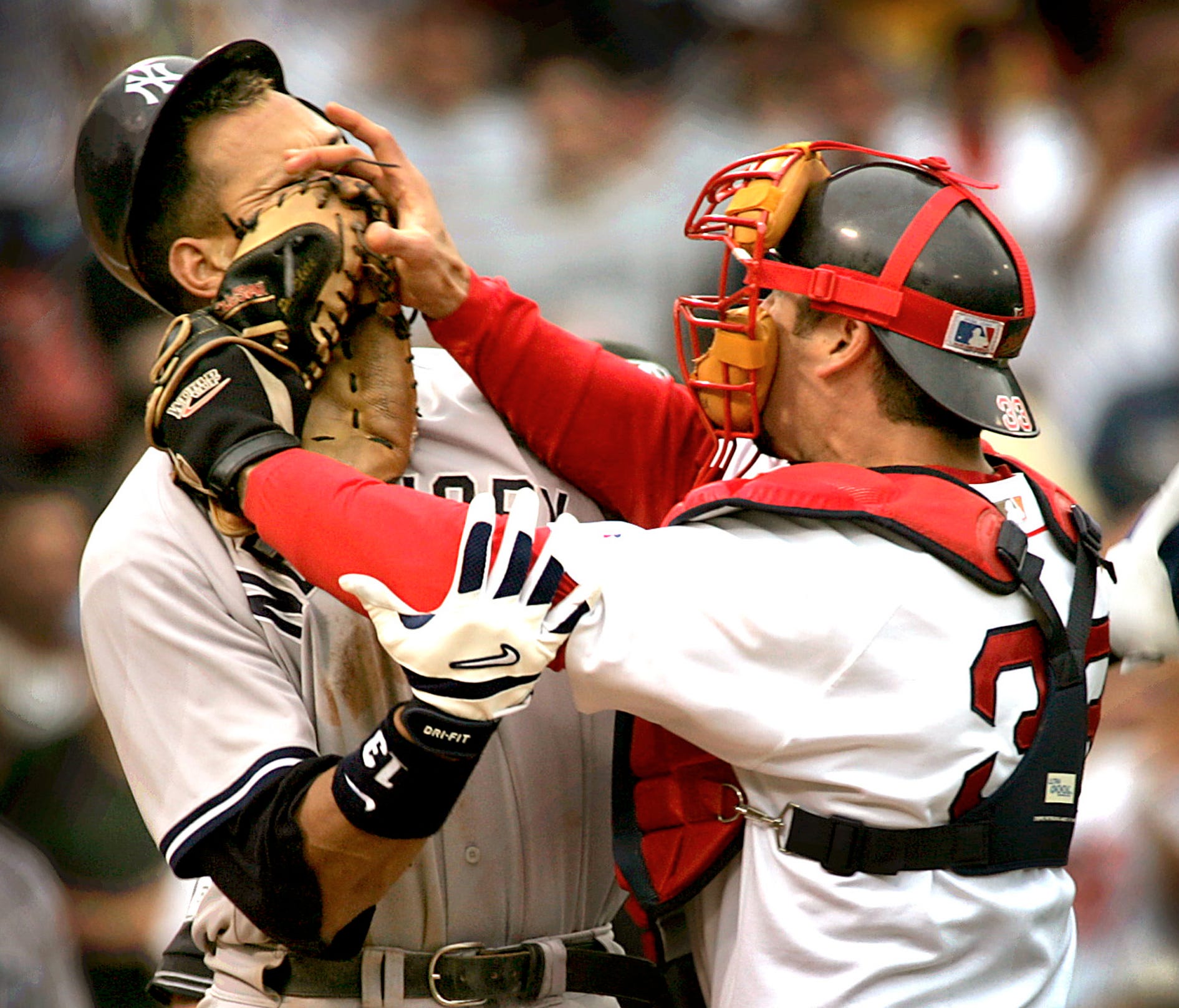 New York Yankees' Alex Rodriguez, left, is pushed by Boston Red Sox catcher Jason Varitek, right, after Rodriguez was hit by a pitch from Red pitcher Bronson Arroyo during a 2004 game.