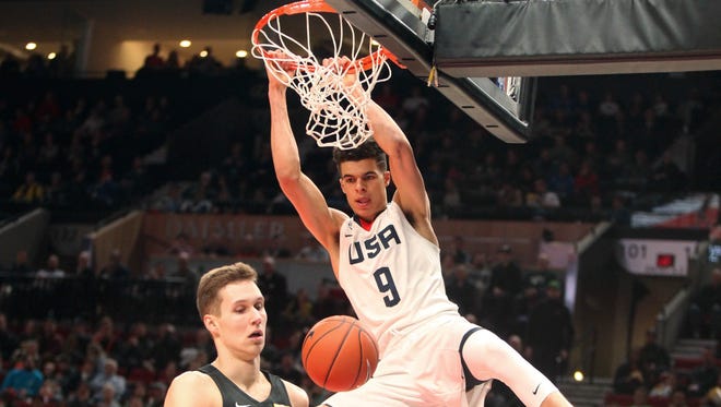 Team USA's Michael Porter Jr. dunks during the first half of the Nike Hoop Summit basketball game in Portland, Ore., Friday, April 7, 2017