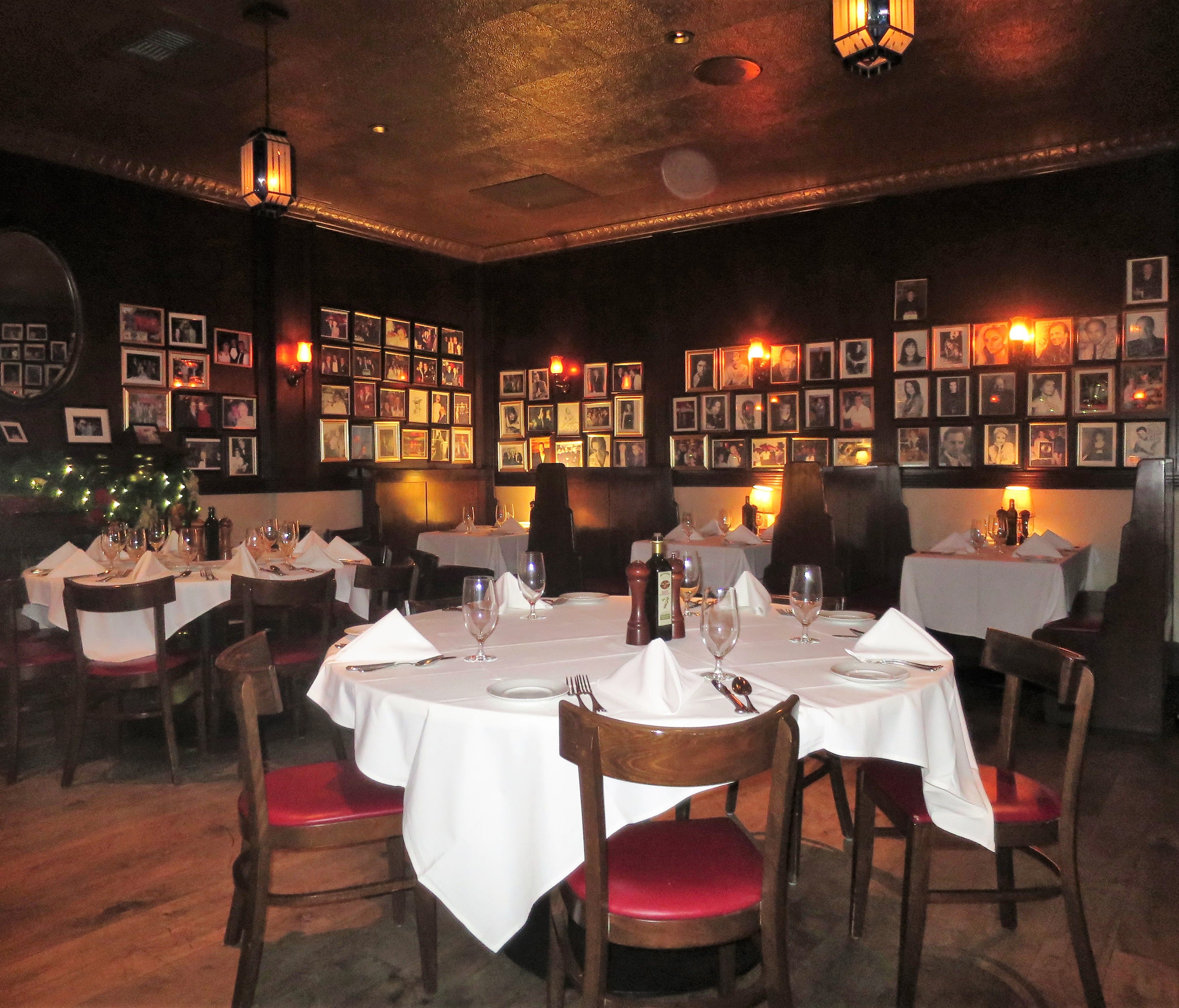 The main dining rooms in Las Vegas (pictured) and Los Angeles are both slightly larger near replicas of the century-old New York original, with worn wood floors and tons of celebrity photos.