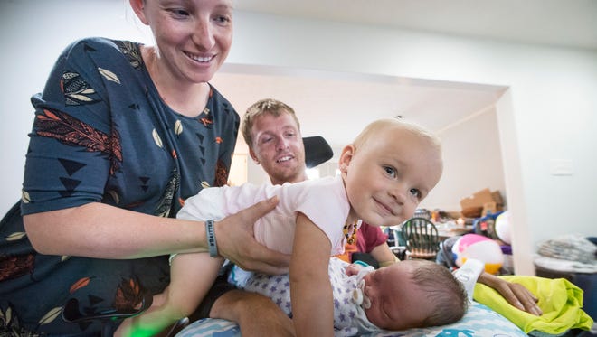Samantha, Britten and little Kolbie Olinger have welcomed Easton into their newly renovated home.