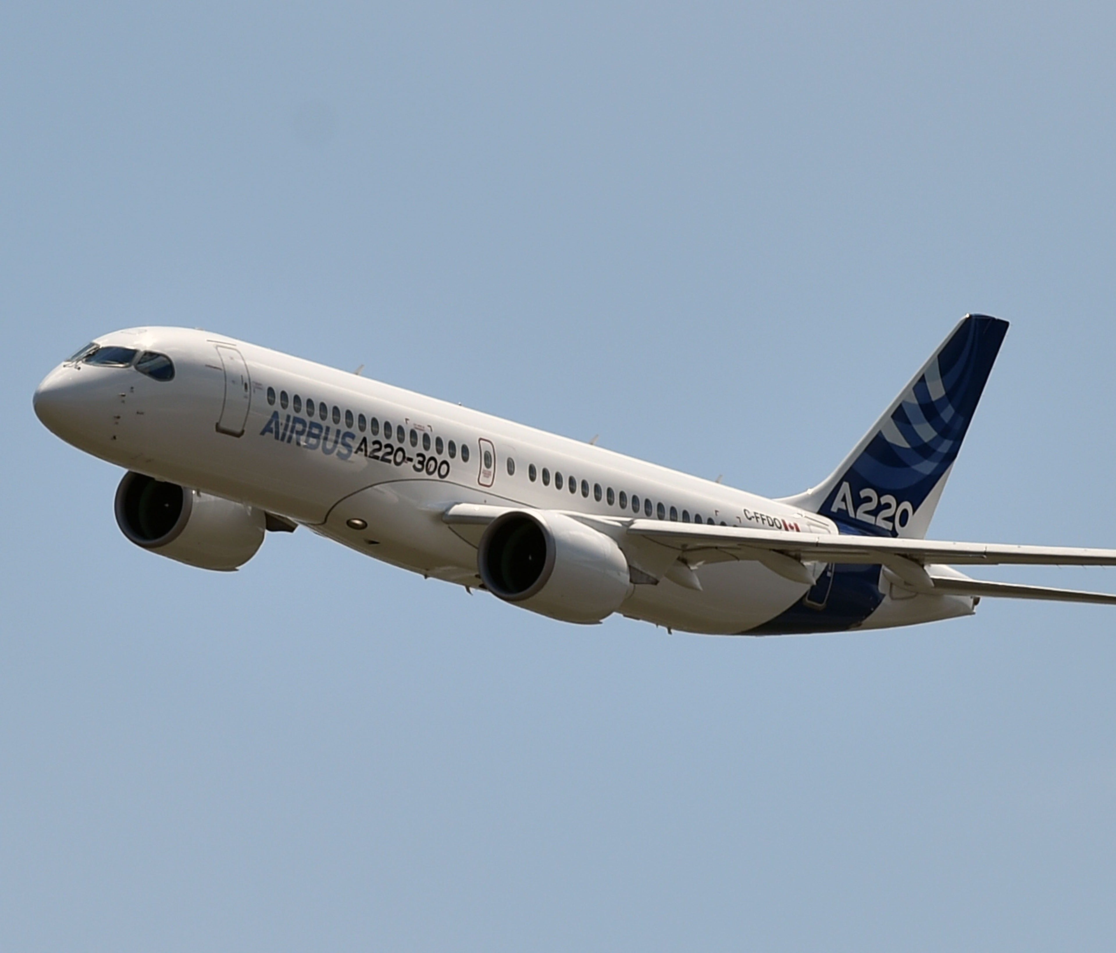 A new Airbus A220-300 aircraft flies July 10, 2018, for the first time at the Airbus delivery center, in Colomiers, south-western France.