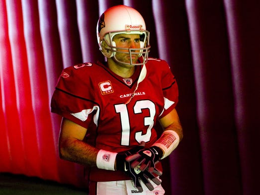 Arizona quarterback Kurt Warner waits to take the field