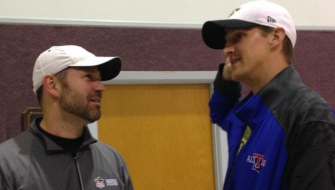 Saints backup quarterback Luke McCown, right, talks with former LSU defensive back Andy Stroup during this weekend's FCA Athlete Retreat in Bethany, La.