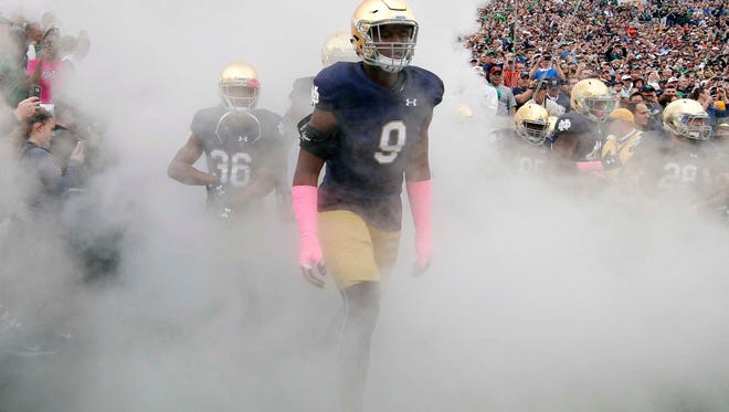 Oct 29, 2016; South Bend, IN, USA;  Notre Dame Fighting Irish defensive lineman Daelin Hayes (9) runs onto the field before the game against the Miami Hurricanes at Notre Dame Stadium.