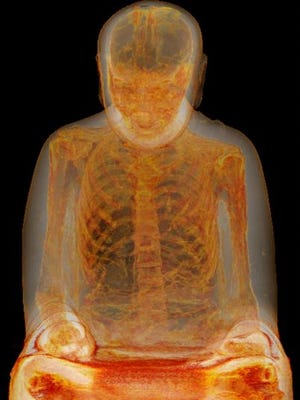 A CT scan by a Dutch team of researchers showed the skeletal remains of a mummified meditating monk inside a seated Buddha statue about 1,000 years old.