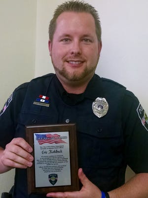 
Kiel police officer Eric Kohlbeck was presented with the department’s Lifesaving Award.
