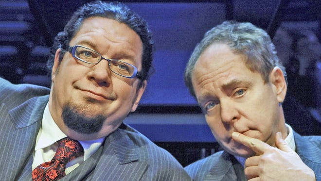 Penn Jillette, left, and Teller take their magic act to Broadway’s Marquis Theatre.