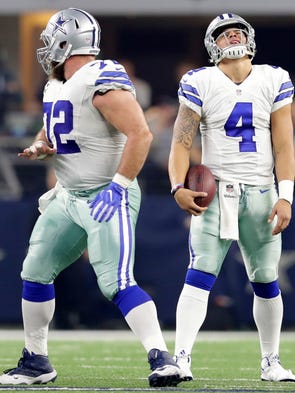 Dallas Cowboys' Dak Prescott reacts to a third quarter