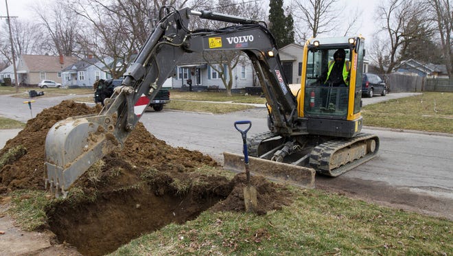 Work continues on the water replacement lines in Flint on March 10, 2017. The project's coordinator said he has a goal of finishing the pipe replacements for residents in 2019 by fixing 6,000 service lines a year.
