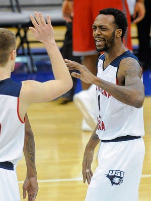 University of Southern Indiana guard Alex Stein (20) high fives Eagles' teammate Jeril Taylor (1) after their 88-71 win over William Jewell  at USI's PAC Center on  Jan. 5.