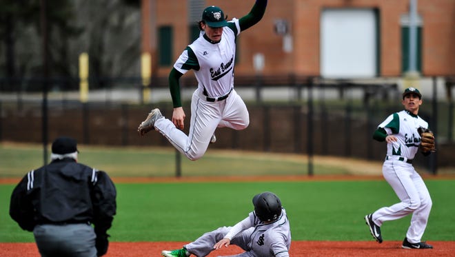 East Brunswick's James Schuld leaps over St Joe's Jonathan Sot as he steals second base during a game in East Brunswick on April 1, 2017.