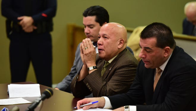 Joey Torres wipes tears from his eyes after being sentenced Tuesday to five years in prison for his role in a corruption scandal during his time as Paterson mayor.