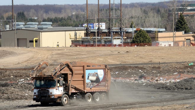A Granger garbage truck enters the landfill in DeWitt Township that includes the Granger Wood Road Generating Station. Granger sold its energy division to Australia-based Energy Developments.