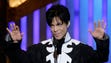 Prince accepts the award for outstanding male artist