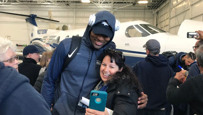 Nevada Wolf Pack player Jordan Caroline takes a selfie with a fan on March 23, 2018, during the team's return to Reno from the NCAA Tournament.