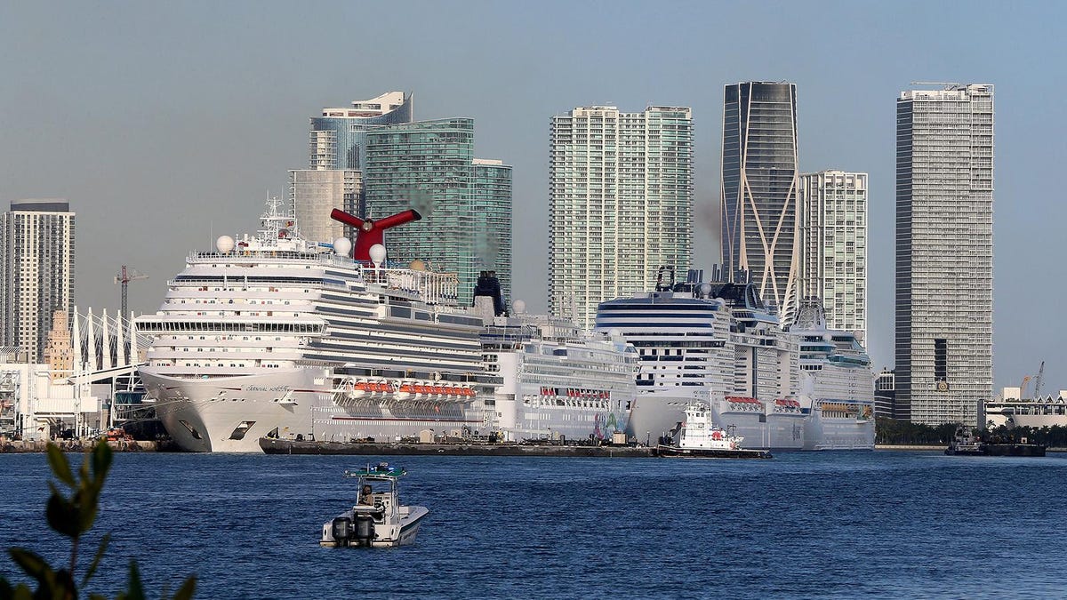 Cruise ships line up along Port Miami on March 15 in Miami, Fla.