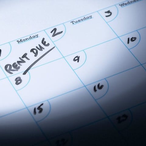 A calendar with "rent due" written on the first of