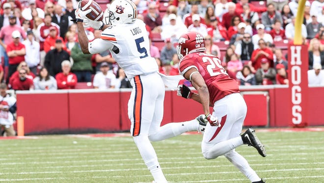 Ricardo Louis (5) attempts to catch a pass against Arkansas in a game on October 24, 2015 in Fayetteville, Ark.