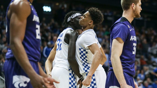 Kentucky's PJ Washington makes a face as he bumps teammate Wenyen Gabriel during the game against K-State Thursday, March 22, 2018 in Atlanta's Sweet Sixteen. UK would lose 61-58.