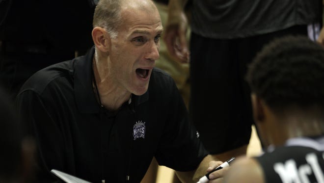 Sacramento Kings assistant coach Chris Jent discusses a play during a second quarter time out of an NBA Summer League game against the Dallas Mavericks at Cox Pavillion on July 13, 2013.