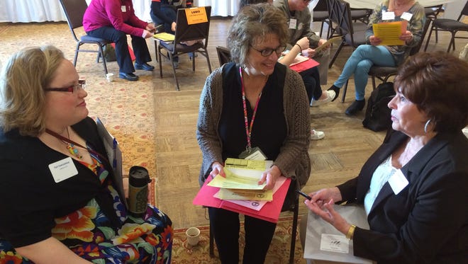 During the recent poverty simulation exercise, Alyssa Bloechl's "family" included Teri VanLieshout of Lakeshore CAP, Cindy Zellner-Ehlers of Human Services, and LouAnn Brown, RN, at Bayview Lutheran Church.