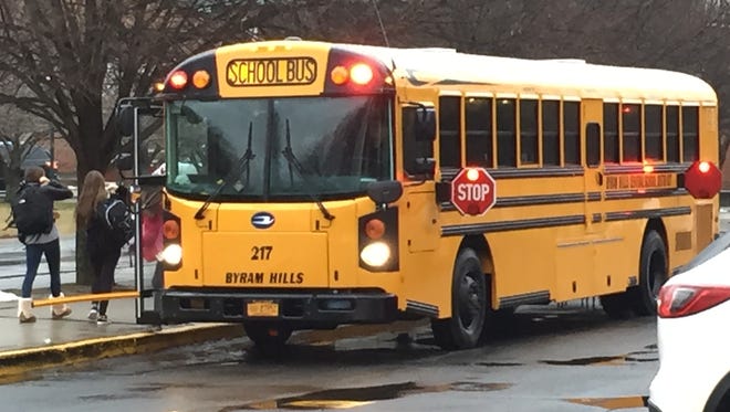 A Byram Hills school bus drops off students at H.C. Crittenden Middle School in North Castle on Thursday, Jan. 12, 2017. The district's schools opened late because of vandalism to numerous buses.