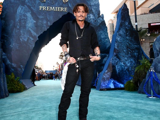 Johnny Depp attends the premiere of Disney's "Pirates