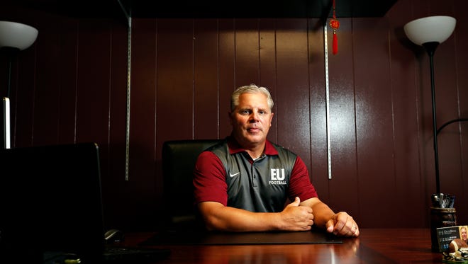New Evangel University football coach Chuck Hepola poses for a portrait in his office in the campus's Ashcroft Center in Springfield, Mo. on Aug. 5, 2016.
