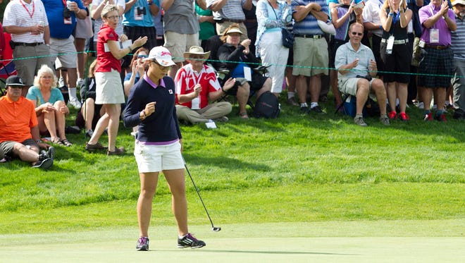 Lydia Ko of New Zealand sinks her putt on No. 6 on her way to victory in the CN Canadian Women's Open.