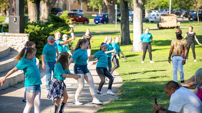 Lone Star Ballet students perform at Sam Houston Park during a previous outdoor performance, featuring a variety of dance styles, from tap to hip hop and ballet.