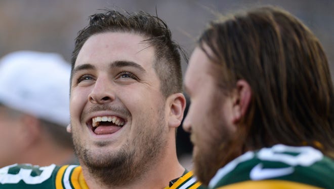 Green Bay Packers center Corey Linsley smiles on the sidelines before the start of the game. The Green Bay Packers hosted the Philadelphia Eagles in a preseason game at Lambeau Field in Green Bay, Wis. on Saturday, Aug. 29, 2015. Kyle Bursaw/Press-Gazette Media/@kbursaw
