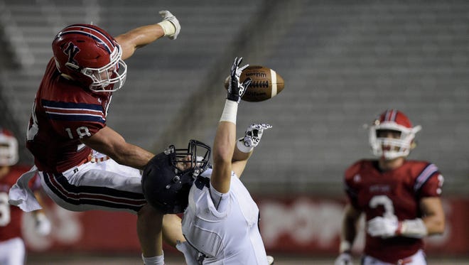 Notre Dame cornerback Hayden Bourgeois (18) swipes the ball away from St. Thomas More receiver Trevor Begue (4) for an incompletion during the Kiwanis Jamboree at Cajun Field in Lafayette, LA, Thursday, Aug. 27, 2015.