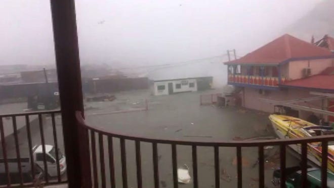 An image taken from a video posted on Facebook by Stefany Santacruz shows the view from her balcony as Hurricane Irma hits the Island of St Maarteen on September 06, 2017 in Filipsburg.Hurricane Irma, one of the most powerful Atlantic storms on record, cut a deadly swath through a string of small Caribbean islands on Wednesday and was on a collision course with Puerto Rico and potentially south Florida.