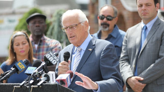 Rep. Bill Pascrell Jr. is shown on East 30th St. in Paterson as he announces the revision of the area flood zone by FEMA.  The revision gives homeowners within the new map the option to not buy flood insurance. Monday August 28, 2017