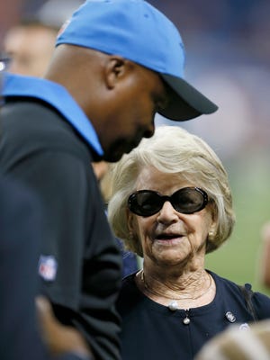 Detroit Lions coach Jim Caldwell talks with team owner Martha Firestone Ford, right, before a game against the Denver Broncos on Sept. 27, 2015, in Detroit.