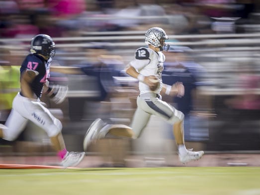 Hamilton quarterback Tyler Shough (12) runs the ball
