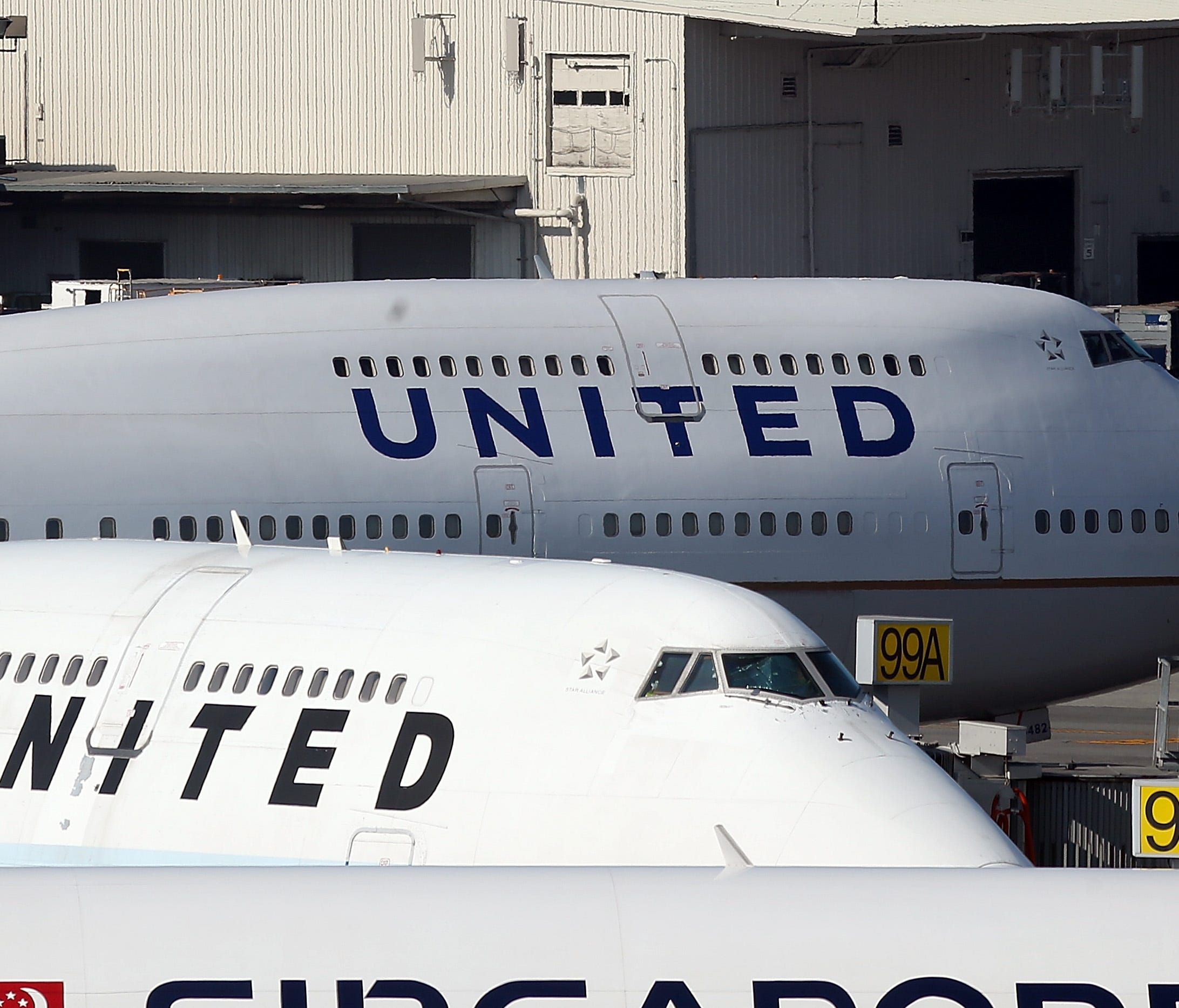 Sunday night's confrontation stemmed from a common air travel issue — a full flight. United was trying to make room for four employees of a partner airline, meaning four people had to get off.