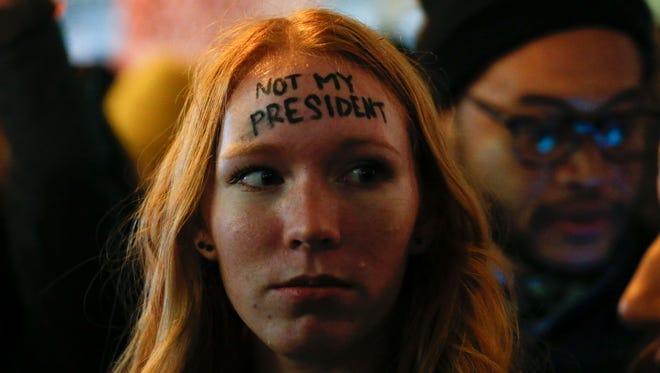 A woman protests Donald Trump in front of Trump Tower in New York on Nov. 10, 2016.