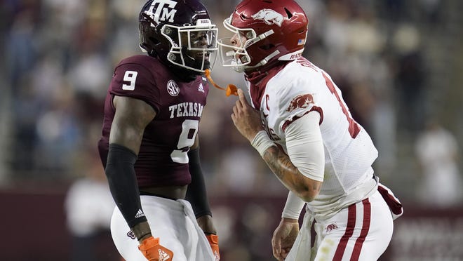 Texas A&M defensive back Leon O'Neal Jr. (9) reacts after tackling Arkansas quarterback Feleipe Franks (13) on Saturday in College Station, Texas.